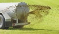 Fertilization with liquid manure on meadow