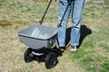 Fertilizing the lawn by fertilizer spreader