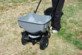 Fertilizing the lawn by fertilizer spreader