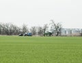 Fertilizing the tractor in the field. Refueling with herbicide