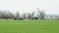 Fertilizing the tractor in the field. Refueling