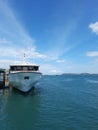 A fery at the & x22;punggur& x22; harbour with blue sea and sky