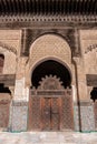 FES, MOROCCO - APRIL 01, 2023 - Traditional oriental facade at the courtyard of madrasa Bou Inaniya in the medina of Fes