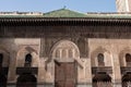 FES, MOROCCO - APRIL 01, 2023 - Traditional oriental facade at the courtyard of madrasa Bou Inaniya in the medina of Fes