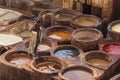 Man working in the leather tanneries in Fes, Morocco. Royalty Free Stock Photo