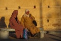 Fes, Morocco - Oct 15, 2019: Two women sitting at the fortress in Fez, Kasbah Cherarda. Also known as Kasbah el-Khemis