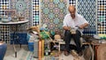 Moroccan craftsman working with ceramics in a craft workshop