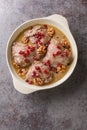 Fesenjan is an Iranian pomegranate and chicken stew made with ground walnuts, onions, squash, cinnamon, and pomegranate molasses