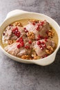 Fesenjan is an Iranian pomegranate and chicken stew made with ground walnuts, onions, squash, cinnamon, and pomegranate molasses