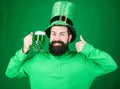 Fest and holiday menu. Dyed green traditional beer. Patricks day party. Alcohol beverage. Symbol of Ireland. Man bearded