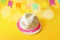 Festa Junina, Brazilian June party greeting card, invitation with straw hat and blurred yellow background with bunting Royalty Free Stock Photo