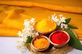 Festival decoration for worshipping haldi and kumkum with vibrant flowers and leaves creating a sacred space with ample room for