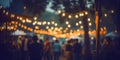 Festival event party outdoor, blurred people background, lights decoration Royalty Free Stock Photo