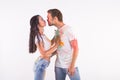 Festival of holi, friendship - young people playing with colors at the festival of holi on white background with copy Royalty Free Stock Photo