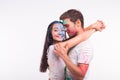 Festival of holi, friendship - young people playing with colors at the festival of holi on white background Royalty Free Stock Photo