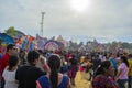 festival of large colorful kites with people walking,