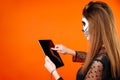 Festival memories. Cheerful woman with painted skull on face takes selfie during celebration of Day of the Dead or Royalty Free Stock Photo