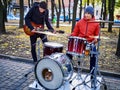Festival music band. Friends playing on percussion instruments city park. Royalty Free Stock Photo