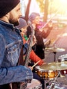 Festival music band. Friends playing on percussion instruments city park. Royalty Free Stock Photo