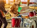 Festival music band. Friends playing on percussion instruments city park. Royalty Free Stock Photo