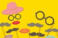 The festival mustache consists of a glasses, lips, hat isolated on yellow background Royalty Free Stock Photo