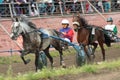 Two jockeys competing in a horse race Royalty Free Stock Photo