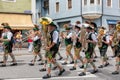 Festival with parade of fanfare and people in traditonal costumes