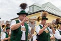 Festival with parade of fanfare and people in traditonal costumes