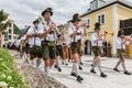 Festival with parade of fanfare and people in traditonal costumes