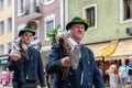 Festival with parade of fanfare and people in traditonal costumes