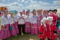 Festival participants in Russian folk costumes of cossack stand in a clearing Royalty Free Stock Photo