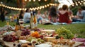 Festivalgoers lounge on blankets enjoying their samples alongside a spread of fresh fruits and cheeses