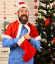 Festivals and presents concept. Man with beard in blue shirt Royalty Free Stock Photo