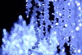 Festive abstract background from glare on a blue background, Christmas and New Year style, fabulous illumination from garlands