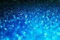 Festive abstract blue glitter texture background with shiny sparkle. Colorful defocused background with glittering and sparkling Royalty Free Stock Photo