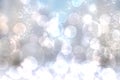 A festive abstract gradient gray silver background texture with glitter defocused sparkle bokeh circles and stars. Card concept Royalty Free Stock Photo