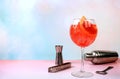 Festive alcoholic cocktail Aperol spritz in glasses on a bright background, concept for bar and New Year\'s Eve, alcoholic