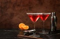 Festive alcoholic cocktail with red martini, lemonade, champagne in glasses on a dark background, bar concept, alcoholic drinks at