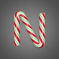 Festive alphabet letter N uppercase. Christmas font made of mint striped candy canes. 3D render on gray background.