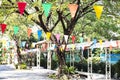 The festive area is decorated with multi-colored triangular flags Royalty Free Stock Photo