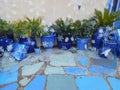 Festive Blue Pots & Blue Tiles With Christmas Gifts Wrapped in Blue Paper