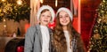 Festive atmosphere christmas day. Boy and girl santa claus hats. Closest people. Family celebrate Christmas. Best