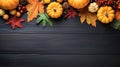 Festive autumn decor from pumpkins, berries and leaves on adark wooden background. Concept of Thanksgiving day or Halloween. Flat Royalty Free Stock Photo