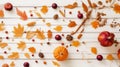 Festive autumn decor from pumpkins, berries and leaves on a white wooden background. Concept of Thanksgiving day or Halloween. Royalty Free Stock Photo