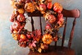 Festive autumn wreath with pumpkin and fall leaves Royalty Free Stock Photo