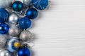 Festive background with blue and silver sparkling christmas balls. Flat lay with copy space for your text Royalty Free Stock Photo