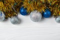 Festive background with blue and silver sparkling christmas balls and tinsel. Flat lay with copy space for your text Royalty Free Stock Photo