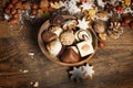 Festive background with candies, nuts, on wooden table