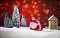 Festive background. Christmas decorations. Santa Claus (or Snowman) standing on snow with beautiful decorated background with Royalty Free Stock Photo