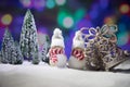 Festive background. Christmas decorations. Santa Claus (or Snowman) standing on snow with beautiful decorated background with Royalty Free Stock Photo